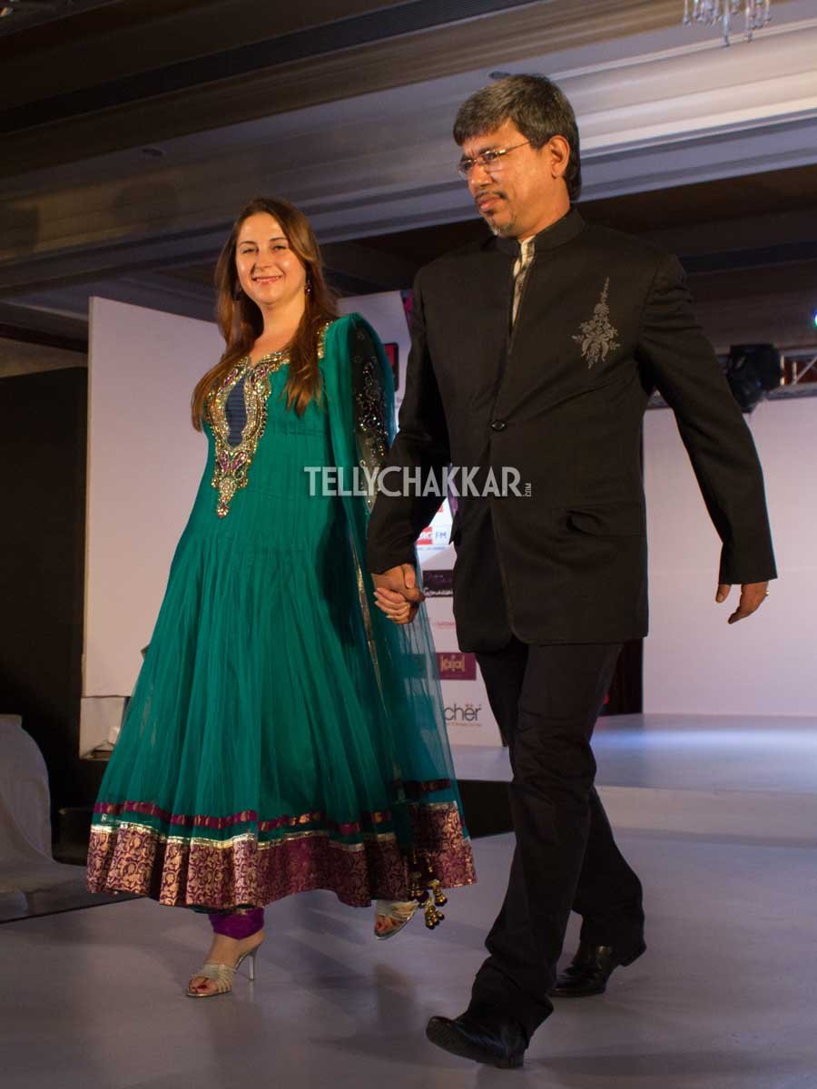 Mr and Mrs Wanvari walk the ramp