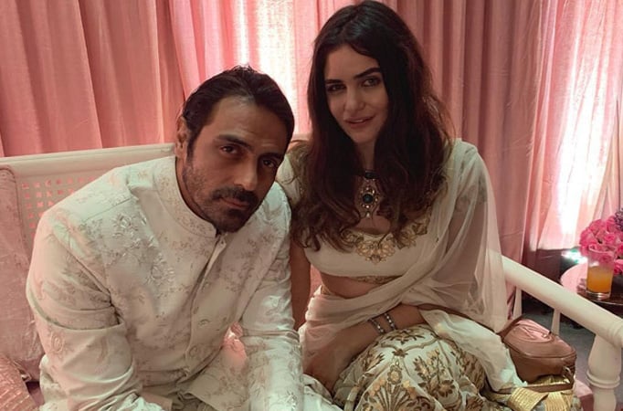 Arjun Rampal and Gabriella Demetriades twin in white