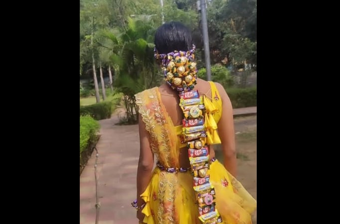 A woman is glammed up with a hairdo and makeup with variety of chocolates, video goes viral 