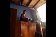 Mudit Nayar atop an almirah