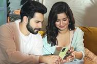 What’s Varun Dhawan got on his phone that has Avneet Kaur so interested?
